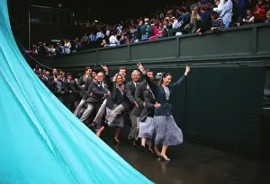 Wimbledon officials do the conga during a rain break on Centre Court in 1992