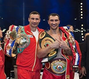 Other Sports Collection: + Wladimir Klitschko with his brother Vitali after defeating David Haye in Hamburg